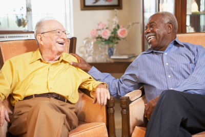 two senior man laughing